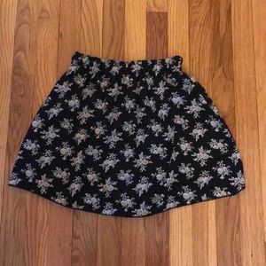 Black skirt with white flower details